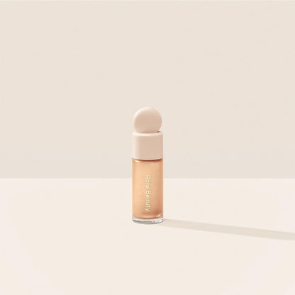 Mini Liquid Luminizer in Positive Light by Rare Beauty